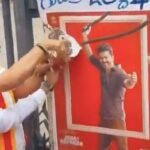 Activists tearing Jana Nayagan film poster during Cauvery protest in Mandya