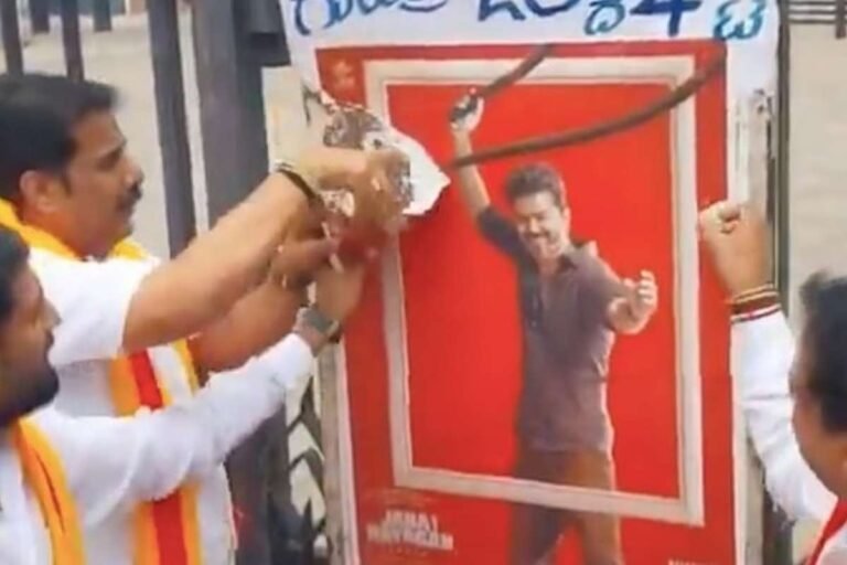 Activists tearing Jana Nayagan film poster during Cauvery protest in Mandya