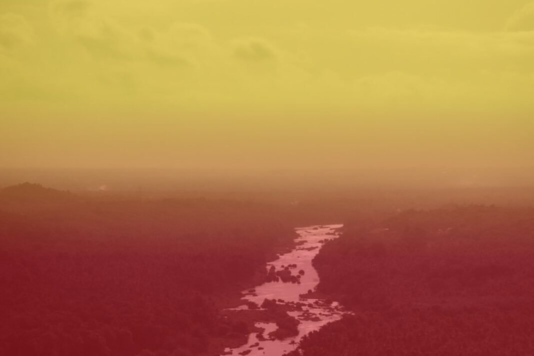 Cauvery river valley tinted in Kannada flag yellow and red colors, representing Karnataka bandh call over water dispute