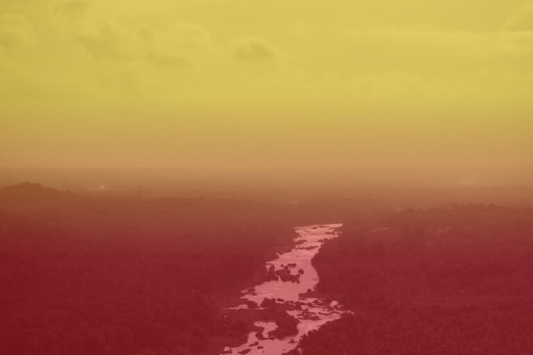 Cauvery river valley tinted in Kannada flag yellow and red colors, representing Karnataka bandh call over water dispute